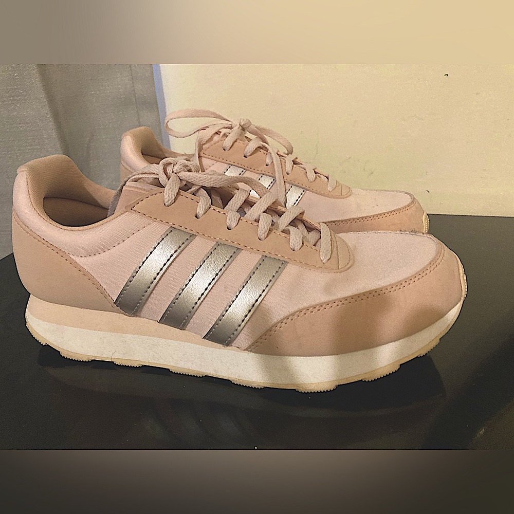 Adidas pink tennis shoes.